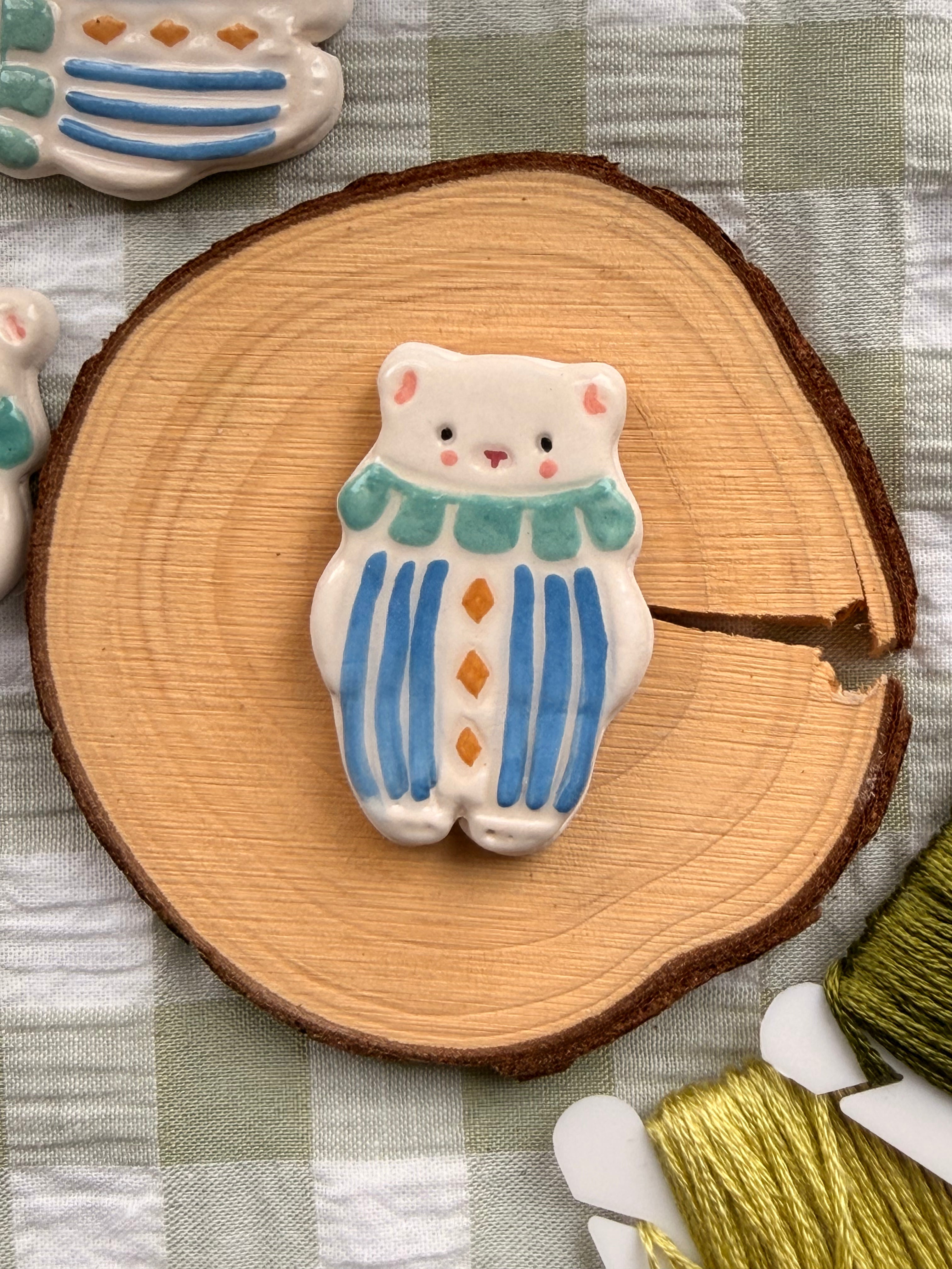 Handmade Ceramic Needle Minder – White Circuses Bear